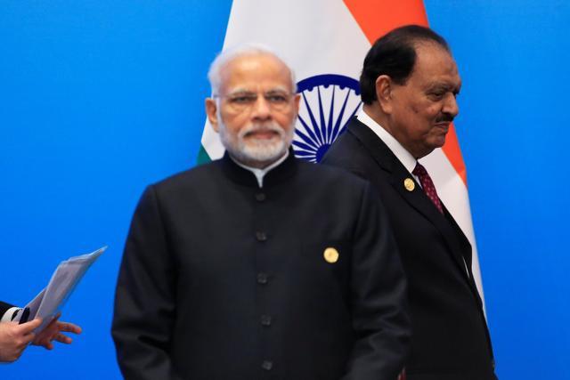 Pakistan's President Mamnoon Hussain walks past Prime Minister Narendra Modi as they arrive for a signing ceremony during Shanghai Cooperation Organization (SCO) summit in Qingdao, Shandong Province, China on June 10. (REUTERS) Pakistan's President Mamnoon Hussain walks past Prime Minister Narendra Modi as they arrive for a signing ceremony during Shanghai Cooperation Organization (SCO) summit in Qingdao, Shandong Province, China on June 10. (REUTERS)