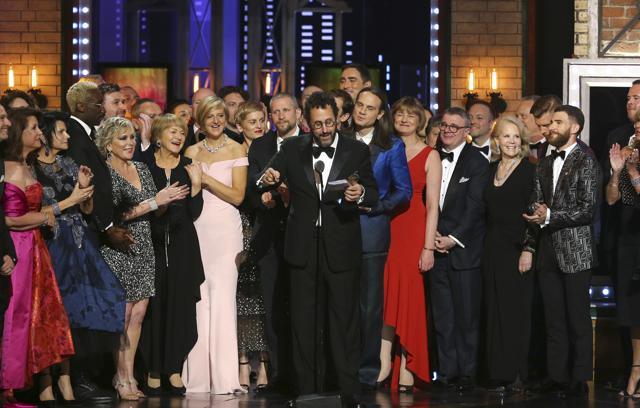 Playwright Tony Kushner, center, and the cast and crew of "Angels in America" accept the award for best revival of a play at the 72nd annual Tony Awards at Radio City Music Hall on Sunday. (AP) Playwright Tony Kushner, center, and the cast and crew of "Angels in America" accept the award for best revival of a play at the 72nd annual Tony Awards at Radio City Music Hall on Sunday. (AP)