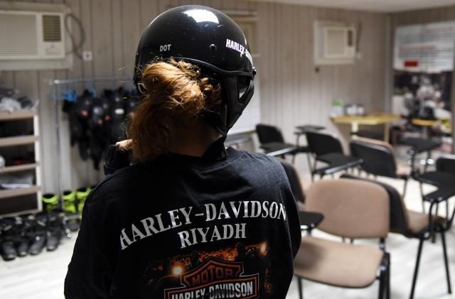 Saudi Noura fastening her helmet ahead of a training session at the Bikers Skills Institute, a motorcycle driving school. (AFP) Saudi Noura fastening her helmet ahead of a training session at the Bikers Skills Institute, a motorcycle driving school. (AFP)