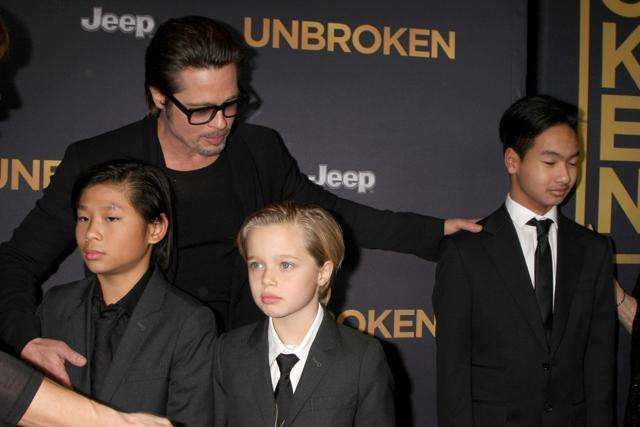 Brad Pitt with Pax (L), Shiloh (C) and Maddox (R) at the premiere of Jolie’s film, Unbroken. (Shutterstock) Brad Pitt with Pax (L), Shiloh (C) and Maddox (R) at the premiere of Jolie’s film, Unbroken. (Shutterstock)