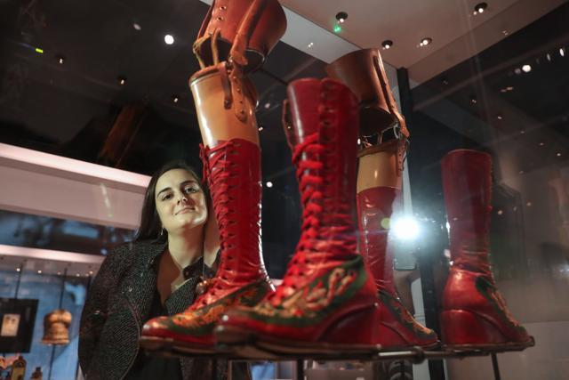 A museum employee poses in front of lace-up boots, 1953-4, Mexico on display. (AFP) A museum employee poses in front of lace-up boots, 1953-4, Mexico on display. (AFP)