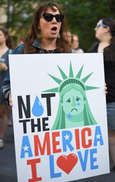 People attend a rally protesting the separation of children from their families while crossing the US border. (AFP Photo) People attend a rally protesting the separation of children from their families while crossing the US border. (AFP Photo)