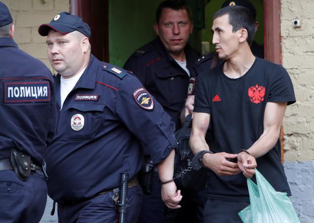 Anarbek Chingiz, taxi driver who ploughed into crowd on June 16 in central Moscow, is escorted by police after a court hearing on his detention in Moscow, Russia June 18, 2018. (REUTERS) Anarbek Chingiz, taxi driver who ploughed into crowd on June 16 in central Moscow, is escorted by police after a court hearing on his detention in Moscow, Russia June 18, 2018. (REUTERS)