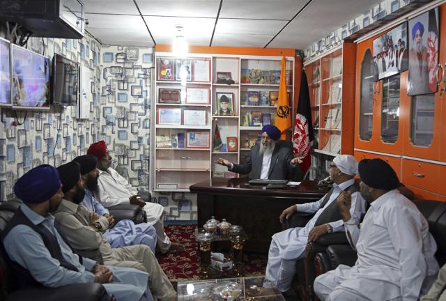 Avtar Singh Khalsa holds a meeting in his office in Kabul, Afghanistan. (AP Photo)