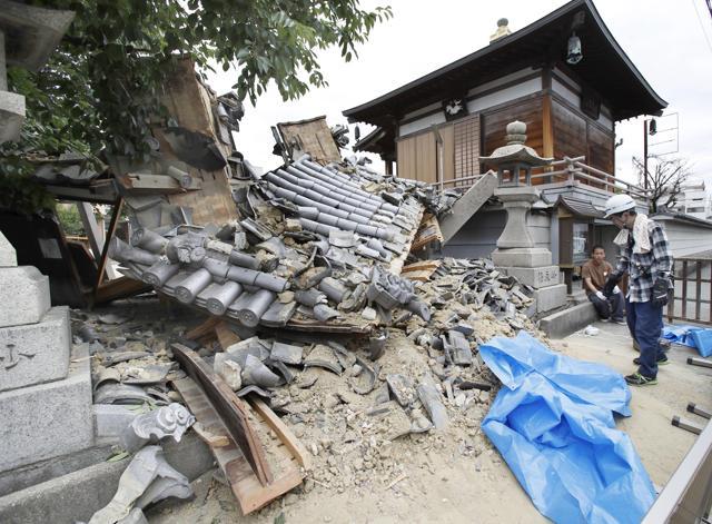 The gate of Myotoku-ji temple collapses after an earthquake hit Ibaraki City, Osaka, western Japan, Monday, June 18, 2018. (AP) The gate of Myotoku-ji temple collapses after an earthquake hit Ibaraki City, Osaka, western Japan, Monday, June 18, 2018. (AP)