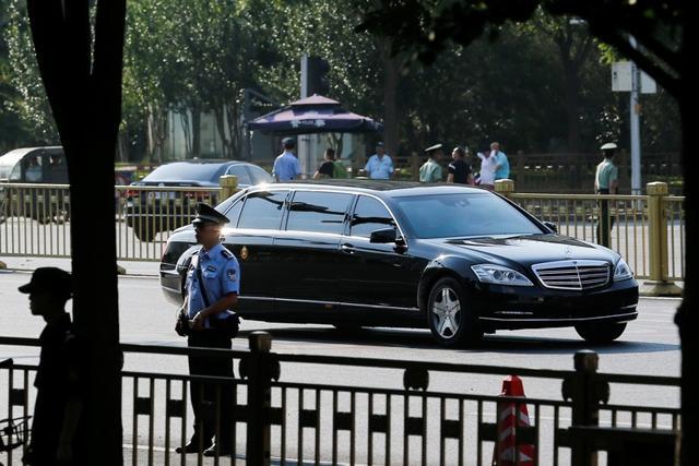 A car believed to be carrying North Korean leader Kim Jong Un drives down Chang'an Avenue towards Tiananmen Square in Beijing, China on June 19. (REUTERS)