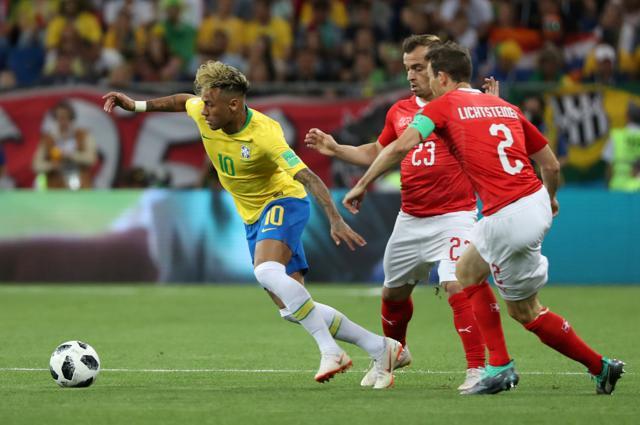 Brazil's Neymar in action with Switzerland's Xherdan Shaqiri and Stephan Lichtsteiner. (REUTERS)
