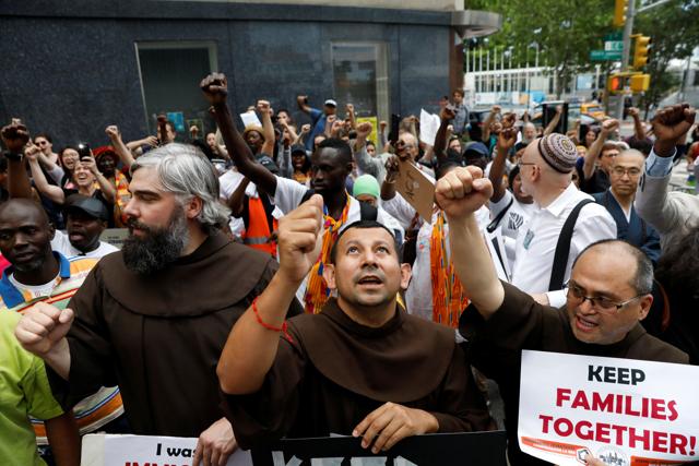 People protest against the Trump administration policy of separating immigrant families suspected of illegal entry, in New York. (REUTERS) People protest against the Trump administration policy of separating immigrant families suspected of illegal entry, in New York. (REUTERS)