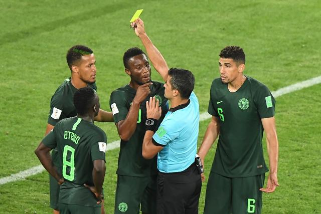 Nigeria's defender William Troost-Ekong (L) receives a yellow card from referee Sandro Ricci. (AFP) Nigeria's defender William Troost-Ekong (L) receives a yellow card from referee Sandro Ricci. (AFP)
