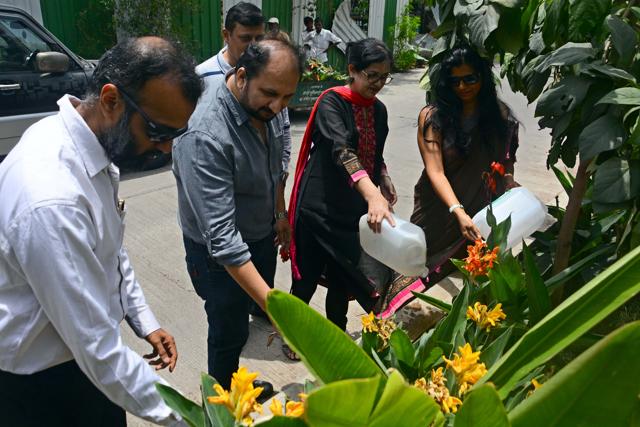 Members of Kalyani Nagar Residents Association tend to plants planted by them. (SHANKAR NARAYAN/HT PHOTO)