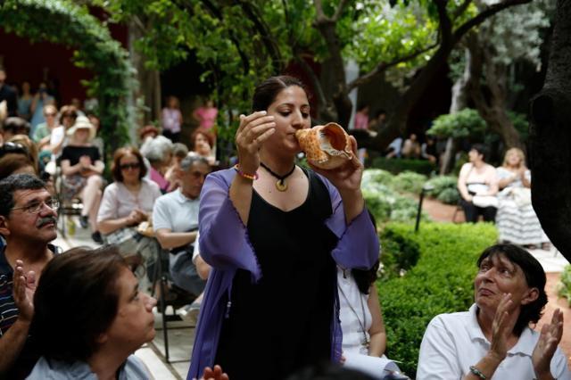 A musician blows a sea-shell during a concert with reconstructed ancient instruments at the National Archaeological Museum in Athens. A musician blows a sea-shell during a concert with reconstructed ancient instruments at the National Archaeological Museum in Athens.