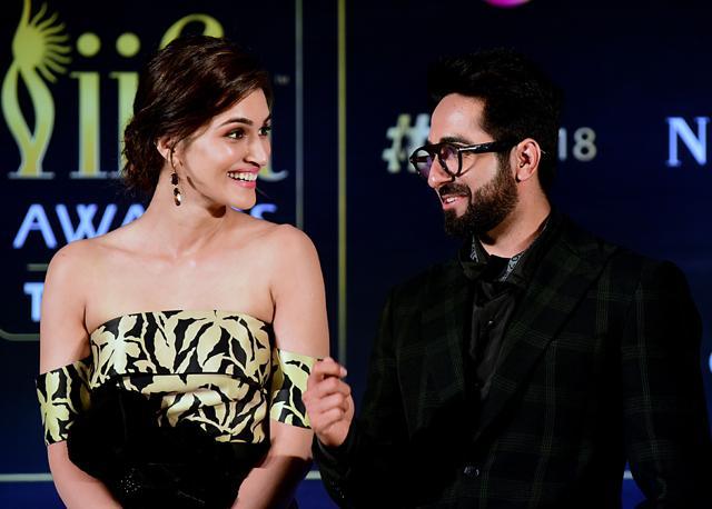 Kriti Sanon and Ayushmann Khurrana interact at the IIFA 2018 press conference in Mumbai on June 12, 2018. (AFP) Kriti Sanon and Ayushmann Khurrana interact at the IIFA 2018 press conference in Mumbai on June 12, 2018. (AFP)
