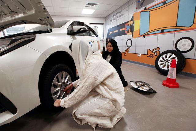 An instructor demonstrates how to tighten wheel nuts on a car tire after changing it at the Saudi Aramco driving school for women at the headquarters of the Saudi Arabian Oil Co. in Dhahran, Saudi Arabia, on Tuesday, June 12, 2018. (Bloomberg) An instructor demonstrates how to tighten wheel nuts on a car tire after changing it at the Saudi Aramco driving school for women at the headquarters of the Saudi Arabian Oil Co. in Dhahran, Saudi Arabia, on Tuesday, June 12, 2018. (Bloomberg)