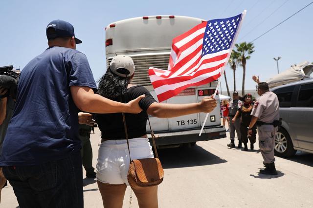 Protesters against the Trump administration's border policies try to block a bus carrying migrant children out of a US Customs and Border Protection Detention Center on June 23 in McAllen, Texas. (AFP Photo) Protesters against the Trump administration's border policies try to block a bus carrying migrant children out of a US Customs and Border Protection Detention Center on June 23 in McAllen, Texas. (AFP Photo)