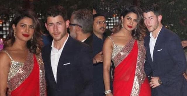 Priyanka Chopra and Nick Jonas pose for photos at the Ambani bash.