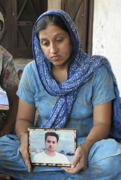 His widow holding Kuljeet Singh’s photo. (Gurminder Singh/HT Photo) His widow holding Kuljeet Singh’s photo. (Gurminder Singh/HT Photo)
