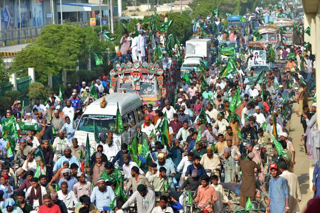 Activists of the Tehreek-e-Labaik Pakistan, an Islamist political party, march in a rally during an election campaign in Karachi on July 1. (AFP) Activists of the Tehreek-e-Labaik Pakistan, an Islamist political party, march in a rally during an election campaign in Karachi on July 1. (AFP)