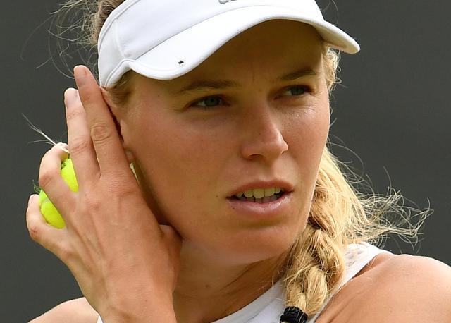 Caroline Wozniacki's in action during her second round match against Ekaterina Makarova. (REUTERS) Caroline Wozniacki's in action during her second round match against Ekaterina Makarova. (REUTERS)