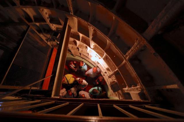 Tourists stand near the stairway leading into Stalin's Bunker, a complex built in 1942 as an alternative headquarters for the Soviet Union leader Joseph Stalin, in Samara. (Reuters)
