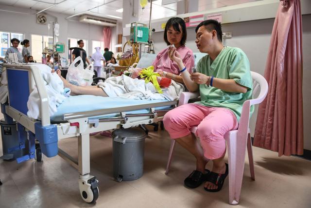 Rescued passengers of the capsized tourist boat in rough seas Wu Jun and his wife Long Hai Ning at a hospital in Phuket. (AFP Photo) Rescued passengers of the capsized tourist boat in rough seas Wu Jun and his wife Long Hai Ning at a hospital in Phuket. (AFP Photo)