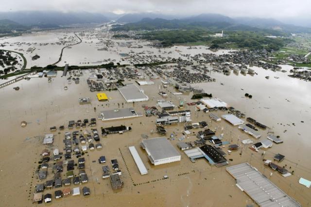 An aerial view shows submerged houses and facilities at a flooded area in Kurashiki, southern Japan, in this photo taken by Kyodo July 7, 2018. (Reuters/Kyodo) An aerial view shows submerged houses and facilities at a flooded area in Kurashiki, southern Japan, in this photo taken by Kyodo July 7, 2018. (Reuters/Kyodo)
