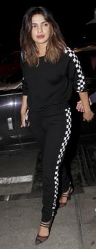 Actor Priyanka Chopra opts for a chic tracksuit and pairs it with stylish heels at the airport. (Photo: Yogen Shah ) Actor Priyanka Chopra opts for a chic tracksuit and pairs it with stylish heels at the airport. (Photo: Yogen Shah )