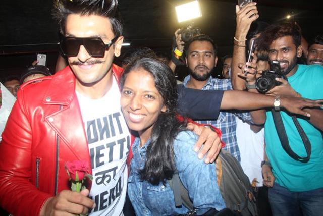 Ranveer Singh gives a fan a warm hug.