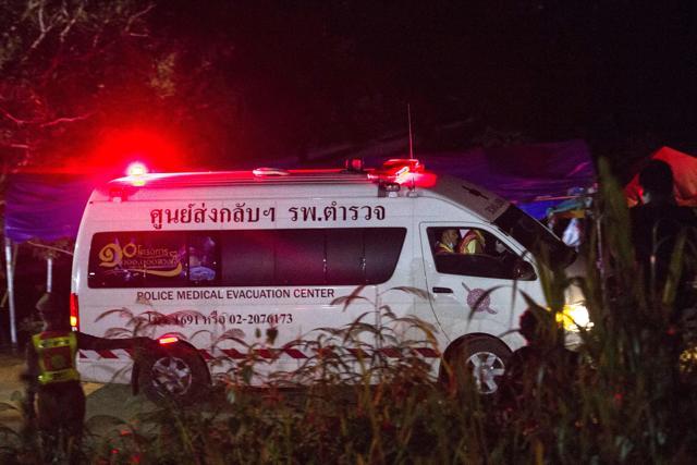 An ambulance allegedly transporting rescued members of the children's football leaves Tham Luang cave area. (AFP Photo) An ambulance allegedly transporting rescued members of the children's football leaves Tham Luang cave area. (AFP Photo)
