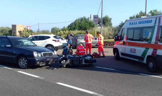 Ambulance personnel tend to a man lying on the ground, later identified as actor George Clooney. (AP)