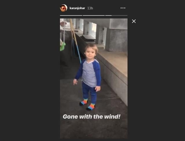 Yash Johar smiles as papa Karan Johar takes a picture. Yash Johar smiles as papa Karan Johar takes a picture.