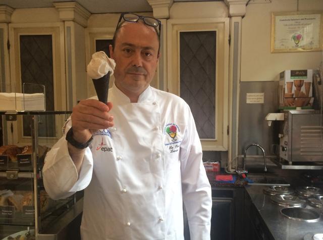 Owner of Gelateria Miretti, Leonardo La Porta holds an ice cream he created and named it CR7 in honour of soccer player Cristiano Ronaldo. (AP) Owner of Gelateria Miretti, Leonardo La Porta holds an ice cream he created and named it CR7 in honour of soccer player Cristiano Ronaldo. (AP)