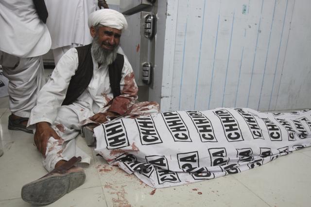 A man mourns next to a body of his family member killed in a bomb blast, in Quetta, Pakistan. (AP Photo) A man mourns next to a body of his family member killed in a bomb blast, in Quetta, Pakistan. (AP Photo)
