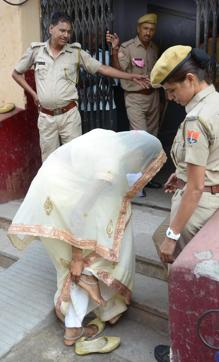 An aspirant removes her anklets before entering examination hall in Jaipur on Sunday. (Prabhakar Sharma/HT Photo)
