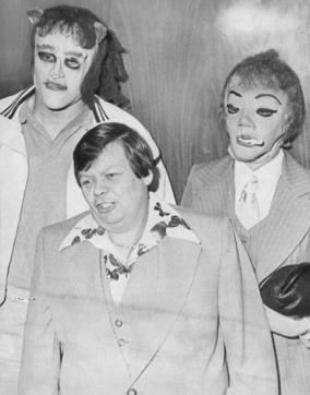This 1979 photo shows transgender man Dante "Tex" Gill, flanked by masked Frank Cocchiara, left, and Donna Potts while leaving the Public Safety Building in Pittsburgh, Pa. Actress Scarlett Johansson has pulled out of the film “Rub & Tug” after her plans to portray Gill prompted a backlash. (AP) This 1979 photo shows transgender man Dante "Tex" Gill, flanked by masked Frank Cocchiara, left, and Donna Potts while leaving the Public Safety Building in Pittsburgh, Pa. Actress Scarlett Johansson has pulled out of the film “Rub & Tug” after her plans to portray Gill prompted a backlash. (AP)