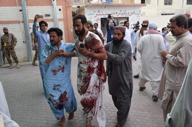 An injured Pakistani man is brought to a hospital in Quetta following a bomb blast at an election rally. (AFP Photo) An injured Pakistani man is brought to a hospital in Quetta following a bomb blast at an election rally. (AFP Photo)
