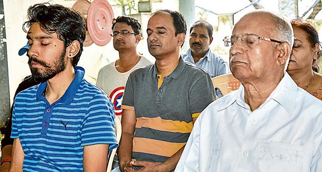 Residents of Vrundavanam Apartment in Model Colony meditate on their society premises in Pune on Sunday. (SANKET WANKHADE/HT PHOTO) Residents of Vrundavanam Apartment in Model Colony meditate on their society premises in Pune on Sunday. (SANKET WANKHADE/HT PHOTO)