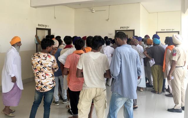 Patients awaiting their turn for medicines at the Outpatient Opioid Assisted Treatment (OOAT) centre at Bhagupur at Patti in Tarn Taran district. (HT Photo) Patients awaiting their turn for medicines at the Outpatient Opioid Assisted Treatment (OOAT) centre at Bhagupur at Patti in Tarn Taran district. (HT Photo)