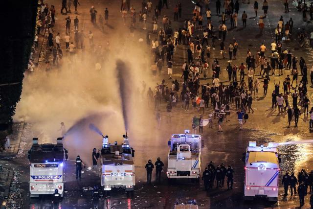 Police disperse people with water canons after celebrations following the Russia 2018 World Cup final football match between France and Croatia, on the Champs-Elysees avenue in Paris on July 15, 2018. (AFP) Police disperse people with water canons after celebrations following the Russia 2018 World Cup final football match between France and Croatia, on the Champs-Elysees avenue in Paris on July 15, 2018. (AFP)