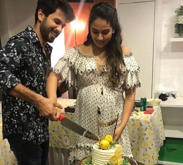 Mira Rajput and Shahid Kapoor cut the cake at the baby shower.