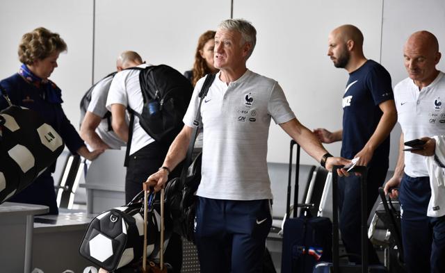 France's coach Didier Deschamps (C) and the team's players depart for home from Moscow. (AFP) France's coach Didier Deschamps (C) and the team's players depart for home from Moscow. (AFP)
