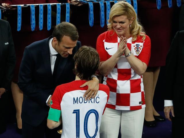 Croatia's midfielder Luka Modric is comforted by French President Emmanuel Macron as Croatian President Kolinda Grabar-Kitarovic (R) looks on at the Luzhniki Stadium in Moscow on July 15, 2018. (AFP) Croatia's midfielder Luka Modric is comforted by French President Emmanuel Macron as Croatian President Kolinda Grabar-Kitarovic (R) looks on at the Luzhniki Stadium in Moscow on July 15, 2018. (AFP)