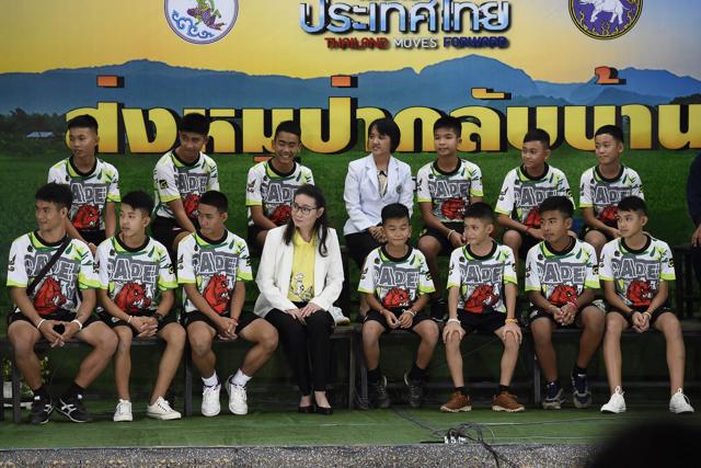 Twelve Thai boys and their football coach, rescued from a flooded cave after being trapped, attend a press conference in Chiang Rai on July 18, 2018, following their discharge from the hospital. The young footballers and their coach appeared healthy when they appeared before the media for the first time. (AFP Photo) Twelve Thai boys and their football coach, rescued from a flooded cave after being trapped, attend a press conference in Chiang Rai on July 18, 2018, following their discharge from the hospital. The young footballers and their coach appeared healthy when they appeared before the media for the first time. (AFP Photo)