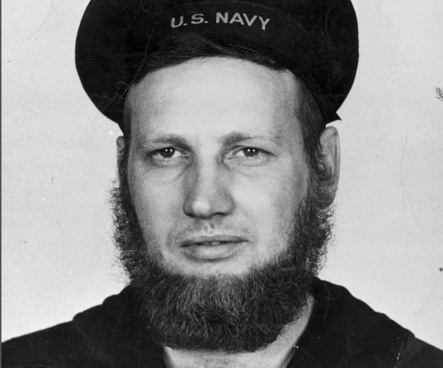 In this June 20, 1942 photo provided by the Naval History and Heritage Command, Howard Curtis, a US Navy second-class aerographer, wears a seven-month's beard at Dutch Harbor, Alaska. (AP) In this June 20, 1942 photo provided by the Naval History and Heritage Command, Howard Curtis, a US Navy second-class aerographer, wears a seven-month's beard at Dutch Harbor, Alaska. (AP)