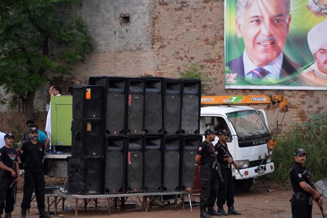 In this picture taken on July 19, 2018, police stand beside a sound system during an election campaign rally by Shahbaz Sharif, the younger brother of ousted Pakistani Prime Minister Nawaz Sharif and the head of Pakistan Muslim League-Nawaz (PML-N), in Pindi Gheb in Pakistan's Punjab province. (AFP) In this picture taken on July 19, 2018, police stand beside a sound system during an election campaign rally by Shahbaz Sharif, the younger brother of ousted Pakistani Prime Minister Nawaz Sharif and the head of Pakistan Muslim League-Nawaz (PML-N), in Pindi Gheb in Pakistan's Punjab province. (AFP)