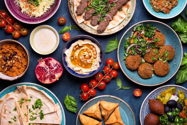 An assortment of middle eastern dishes such as babaganoush, hummus, falafel, etc. (Shutterstock)