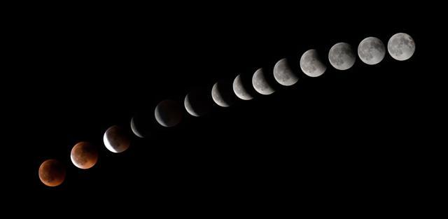 A combination of 14 pictures taken during the lunar eclipse shows the moon in transition over La Puente town, canary Spanish island of Tenerife. (AFP) A combination of 14 pictures taken during the lunar eclipse shows the moon in transition over La Puente town, canary Spanish island of Tenerife. (AFP)
