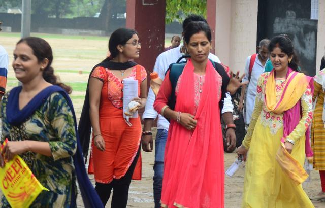 Candidates coming out of a centre after appearing in assistant teacher (Trained Graduate Grade) recruitment exam 2018 in Allahabad on Sunday. (HT photo/Anil Kumar Maurya) Candidates coming out of a centre after appearing in assistant teacher (Trained Graduate Grade) recruitment exam 2018 in Allahabad on Sunday. (HT photo/Anil Kumar Maurya)