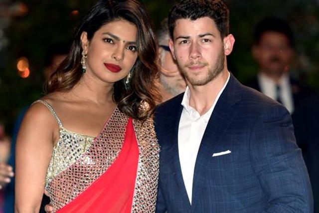 Priyanka Chopra and American singer-songwriter Nick Jonas arrive for Akash Ambani and Shloka Mehta’s engagement ceremony, in Mumbai. (PTI) Priyanka Chopra and American singer-songwriter Nick Jonas arrive for Akash Ambani and Shloka Mehta’s engagement ceremony, in Mumbai. (PTI)