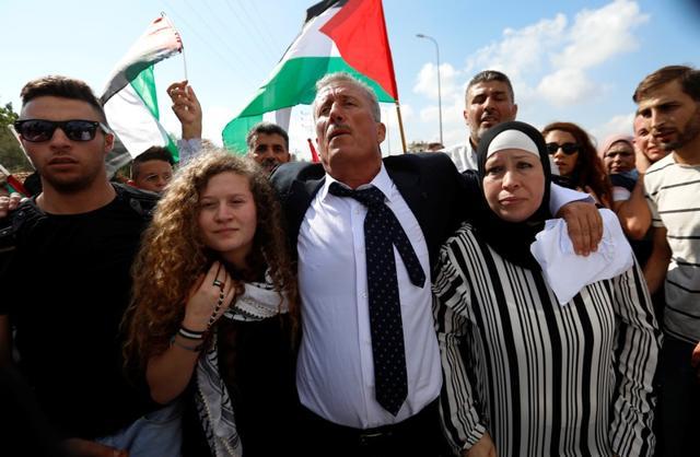 Palestinian teenager Ahed Tamimi and her mother Nareman walk out after they were released from an Israeli prison, at Nabi Saleh village in the occupied West Bank July 29, 2018. (REUTERS) Palestinian teenager Ahed Tamimi and her mother Nareman walk out after they were released from an Israeli prison, at Nabi Saleh village in the occupied West Bank July 29, 2018. (REUTERS)
