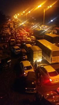 A truck heading out of the city caught fire on the same road on Thursday night, also causing a traffic jam. (HT Photo) A truck heading out of the city caught fire on the same road on Thursday night, also causing a traffic jam. (HT Photo)